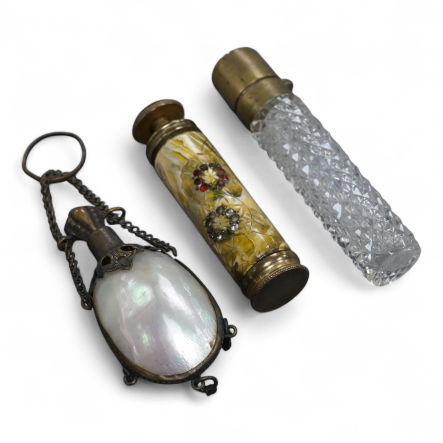 A pump-action scent flask or atomiser and two others, longest 8.5cm